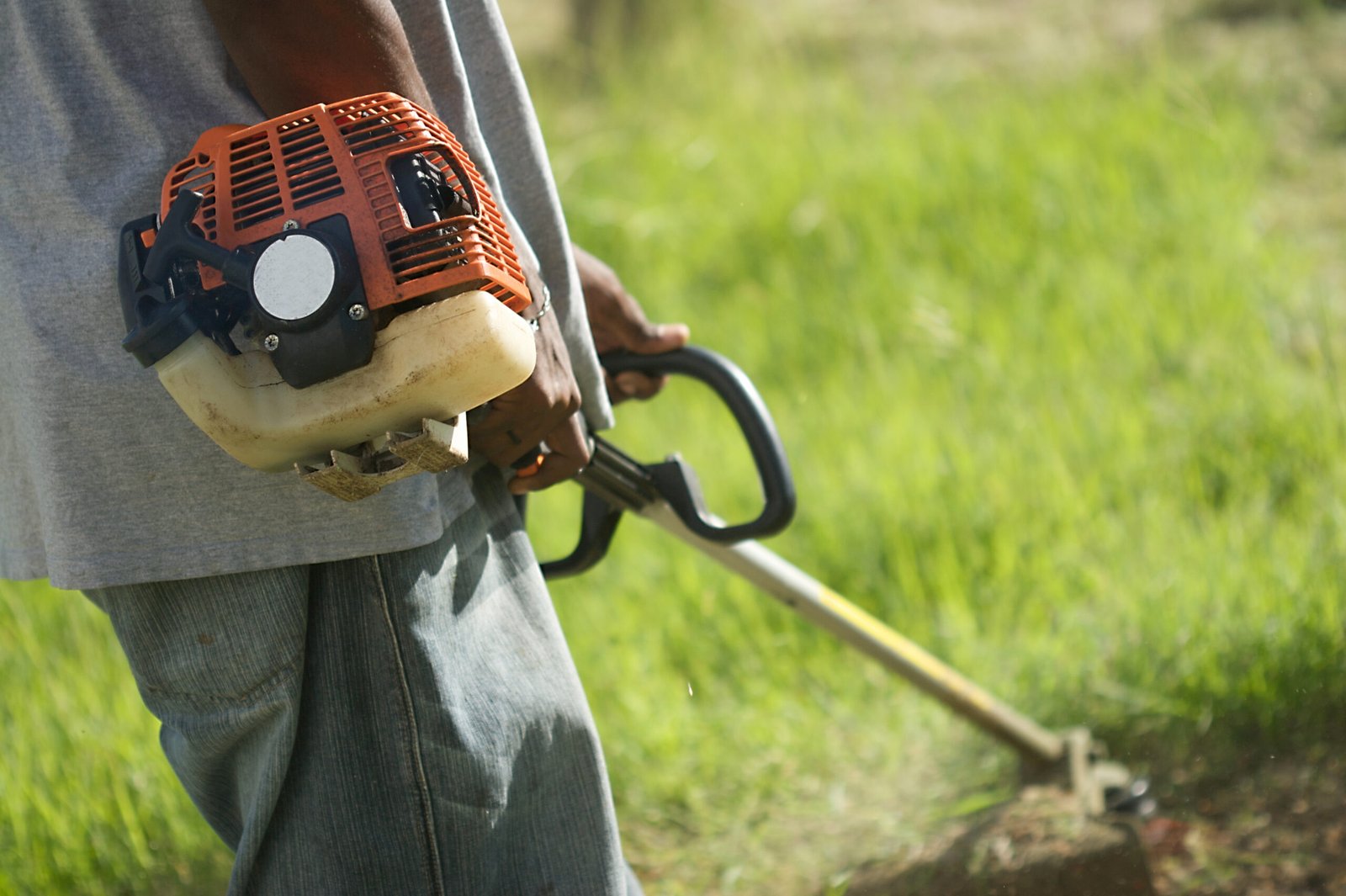 Gardener Mowing